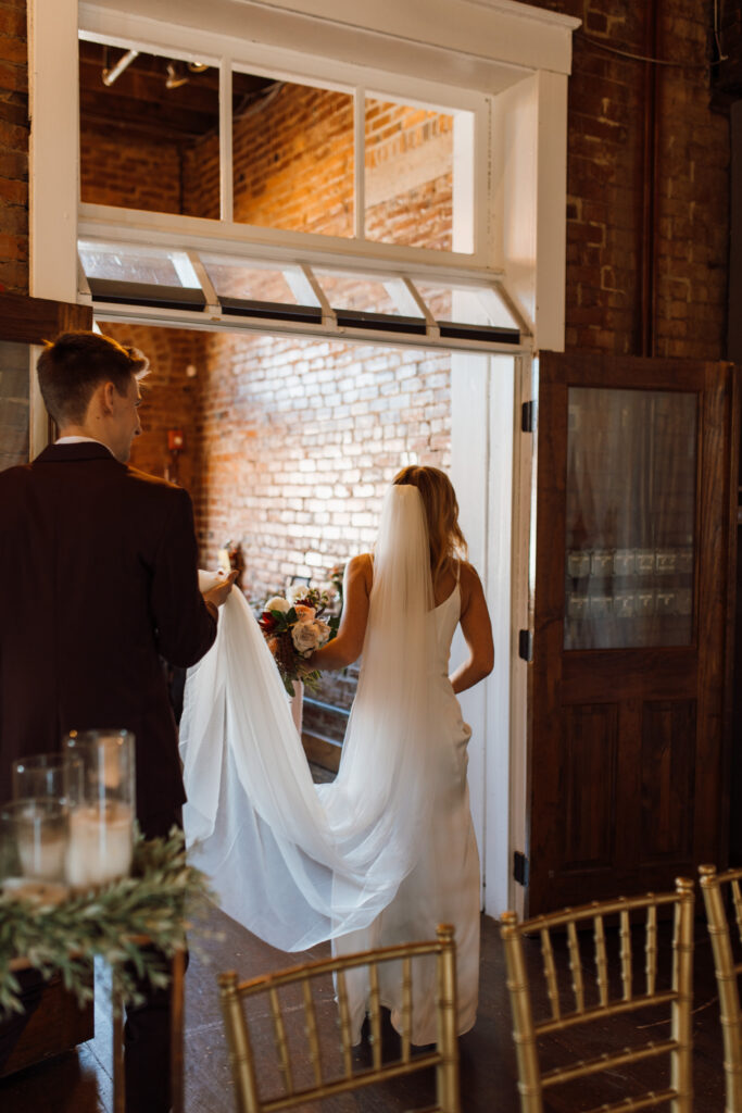 This Fall wedding in Chattanooga Tennessee was stunning with light pouring into their historic wedding venue.